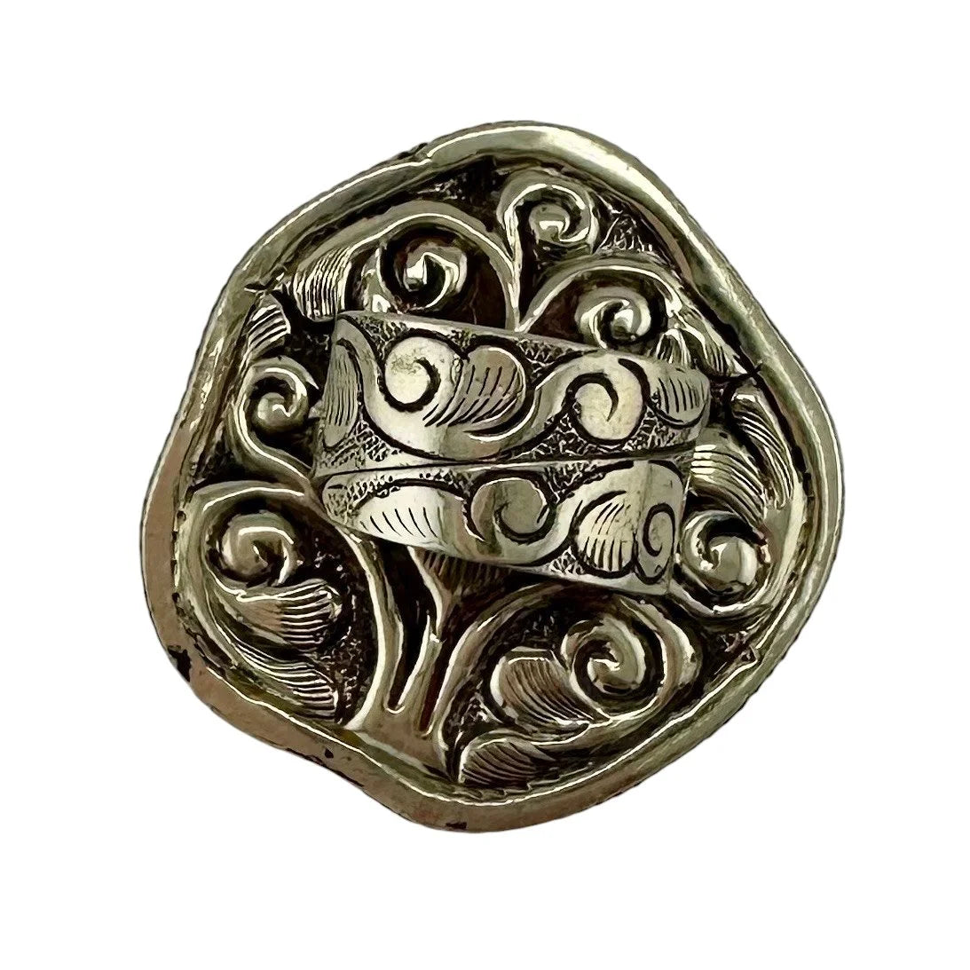 Rear view of decorative Tibetan Silver Ring with intricate designs on a white background