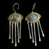 Pair of earrings with gold and silver design on a black background