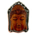 Carved wooden Buddha face with hand tooled silver ring on a white background