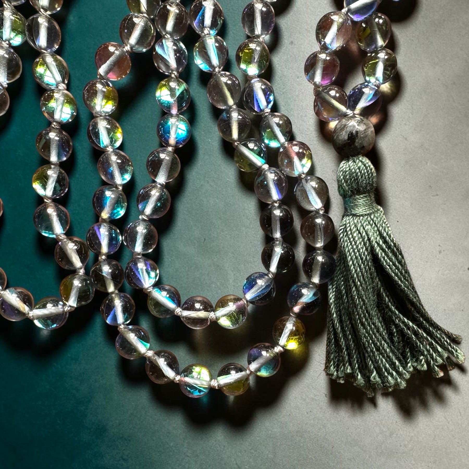 Beaded necklace with a tassel on a dark background