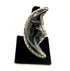 Black and silver crescent moon-shaped ring on a black stand against a white background