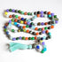 Colorful beaded agate mala necklace with aqua tassel on a white background