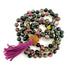 Multicolored beaded tourmaline mala necklace with a tassel on a white background