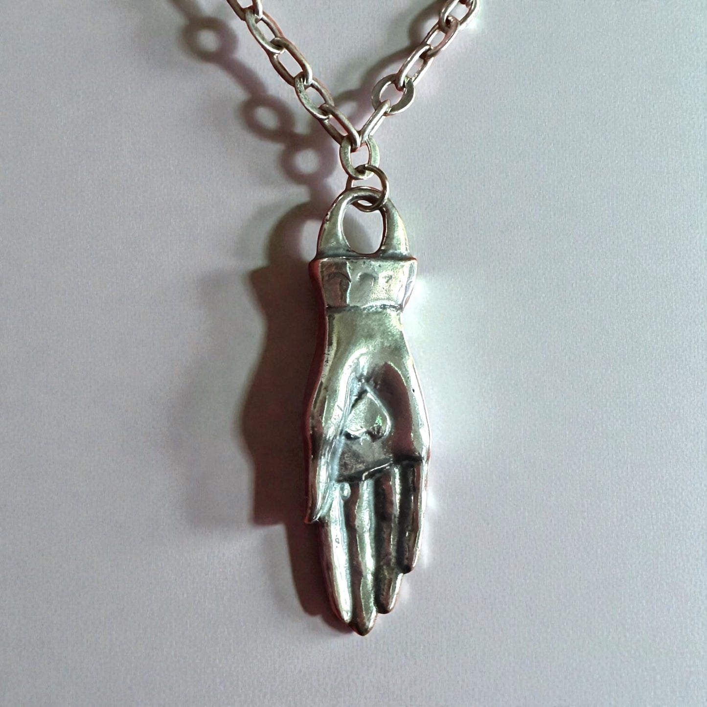 Love Offering Hand Necklace – Sterling Silver over Bronze